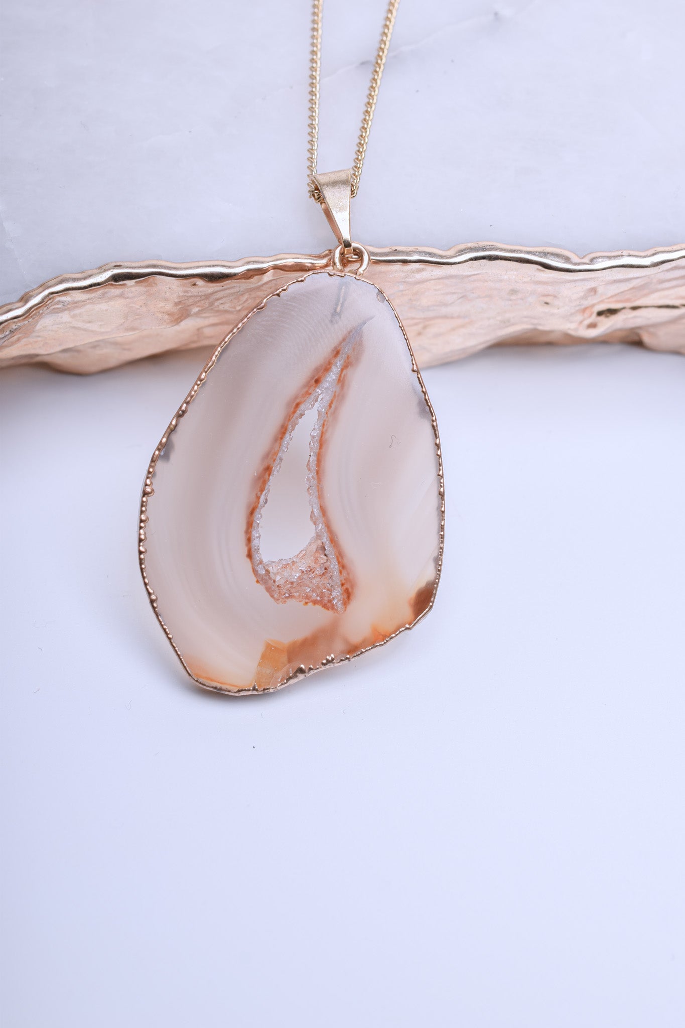 Agate pendant in soft nude shades with crystal formations