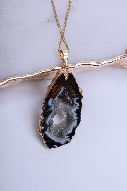 Agate pendant in natural dark shades with crystal formations